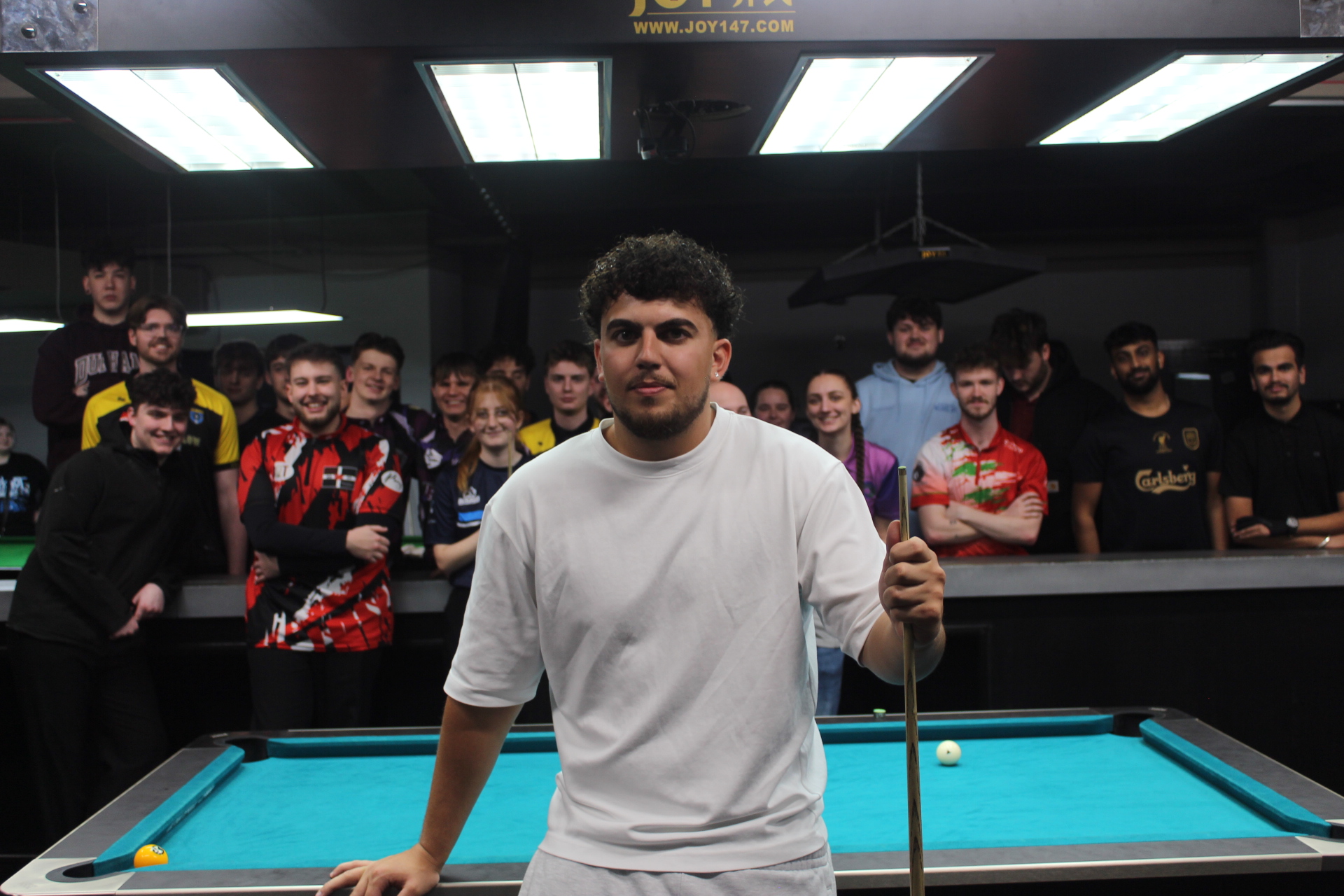 Ayd The Apprentice at the pool table with crowd watching